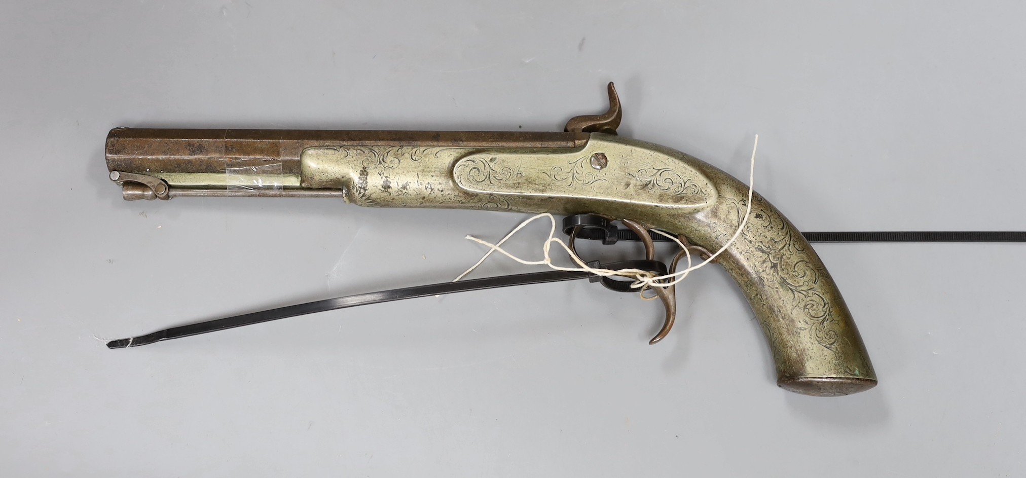 A 19th century Continental engraved brass and steel percussion pistol,32 cms long